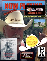 a poster with a man in a cowboy hat and a guitar